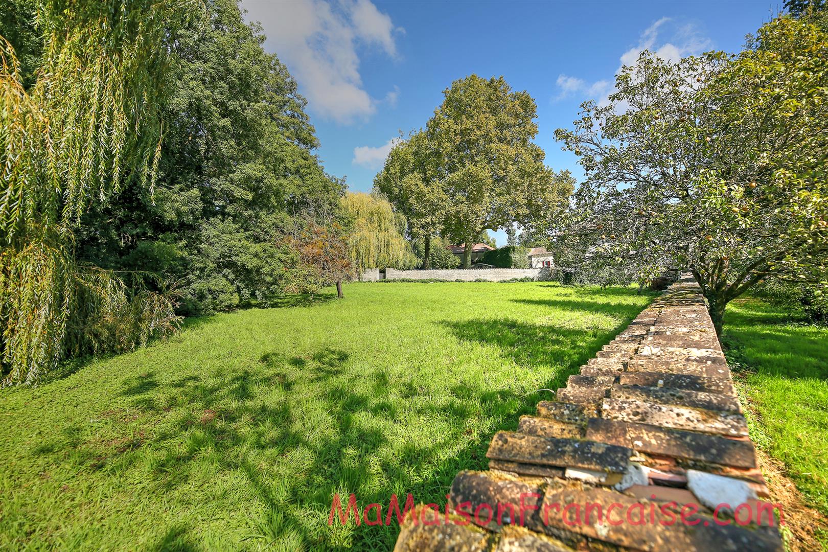 Magnificent Maison de Maître in a town offering spacious, light filled rooms, outbuildings & 5642m2 of land