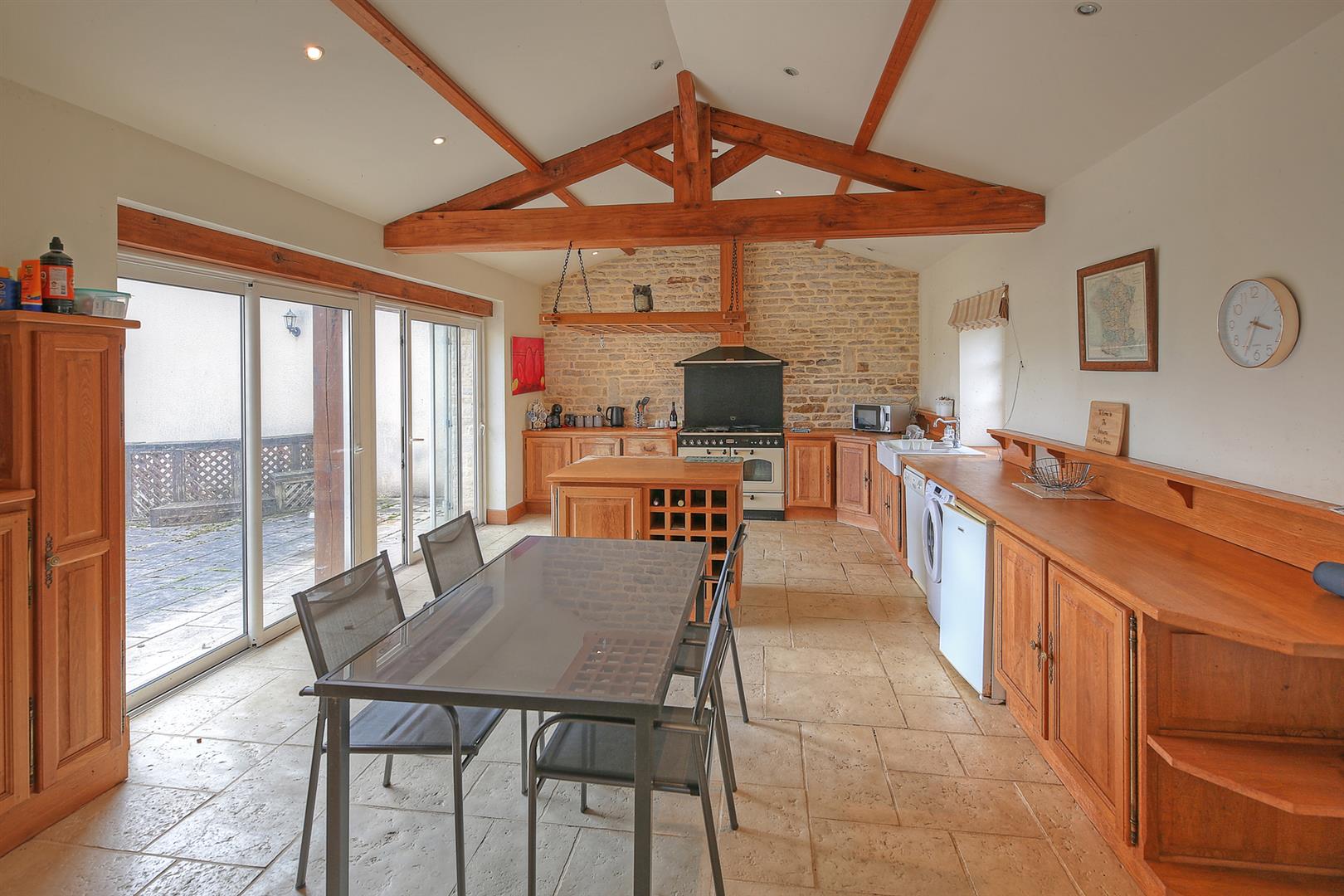 Spacious and light filled barn conversion with guest cottage and 2 acres of gardens.