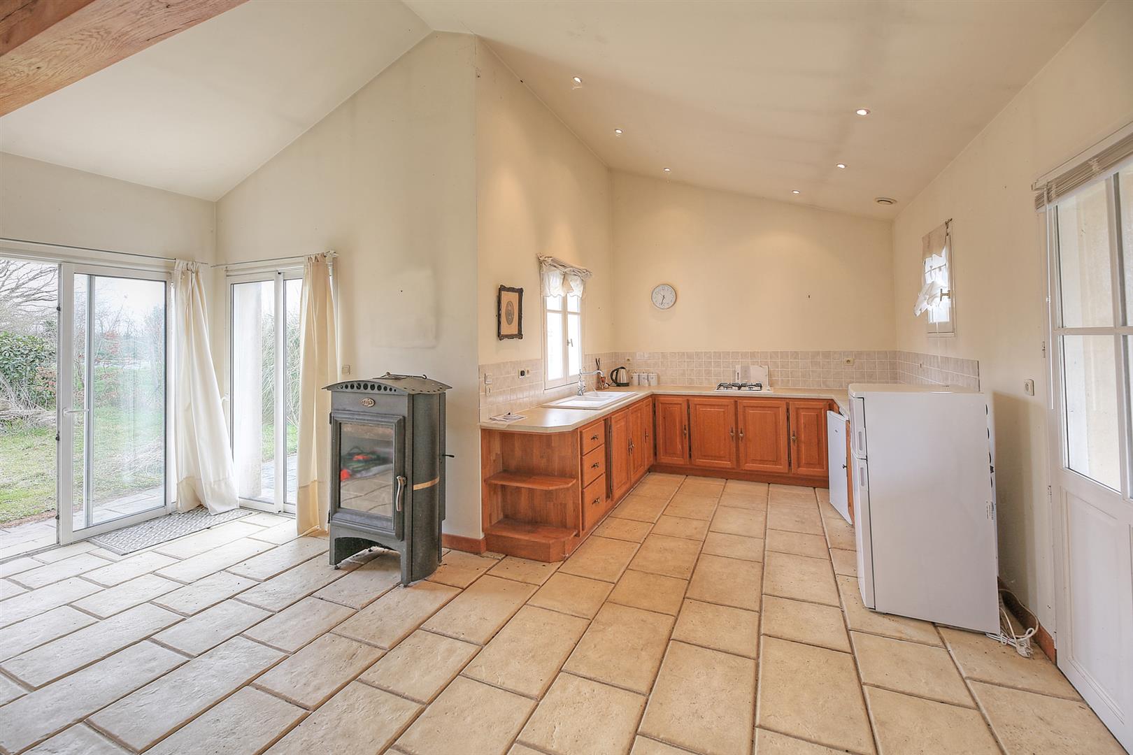 Spacious and light filled barn conversion with guest cottage and 2 acres of gardens.