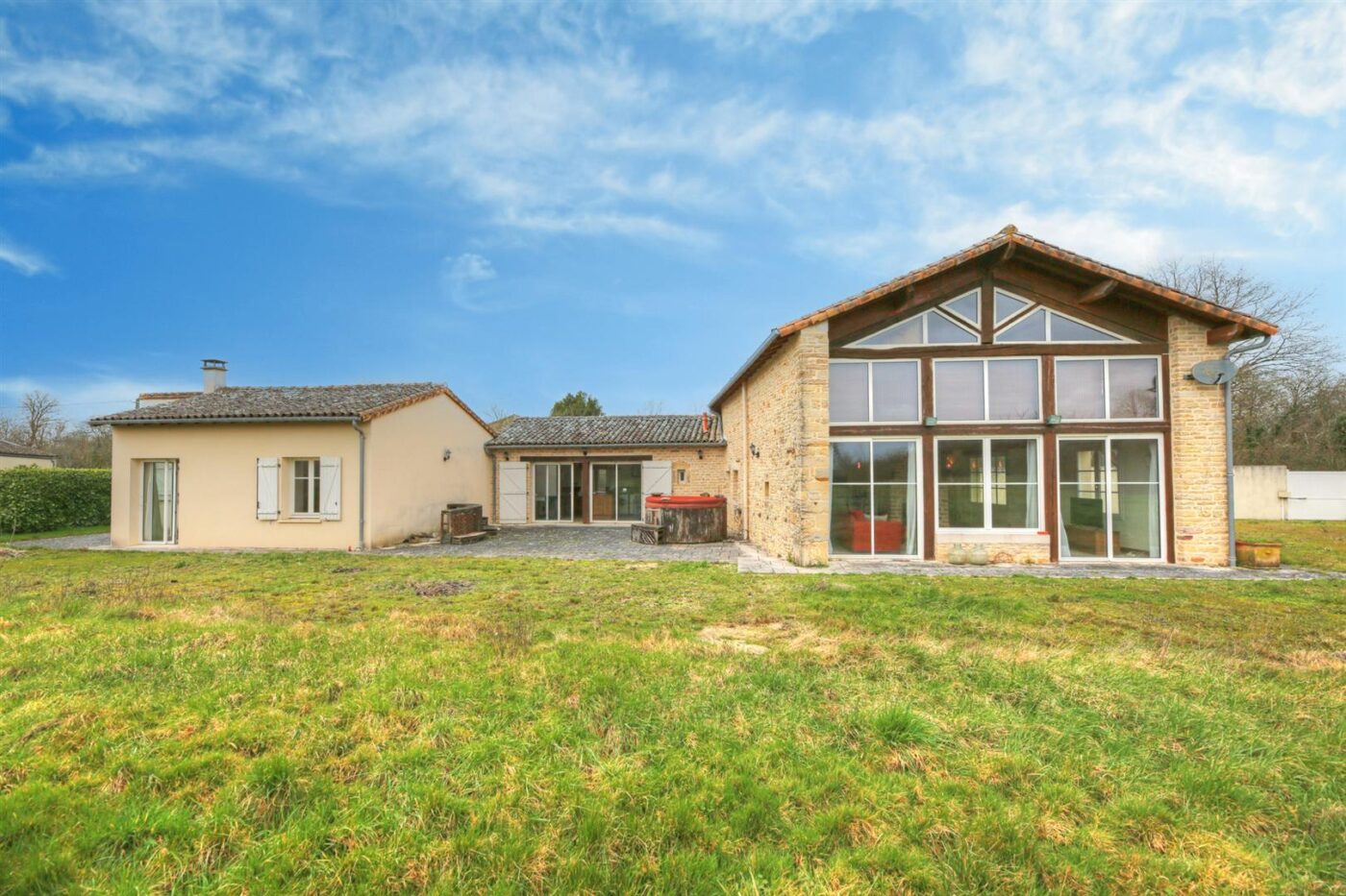 Spacious and light filled barn conversion with guest cottage and 2 acres of gardens.