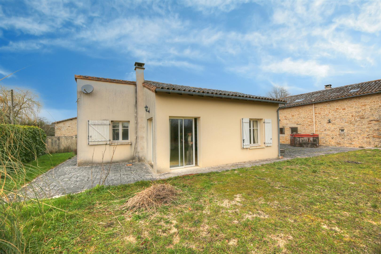 Spacious and light filled barn conversion with guest cottage and 2 acres of gardens.