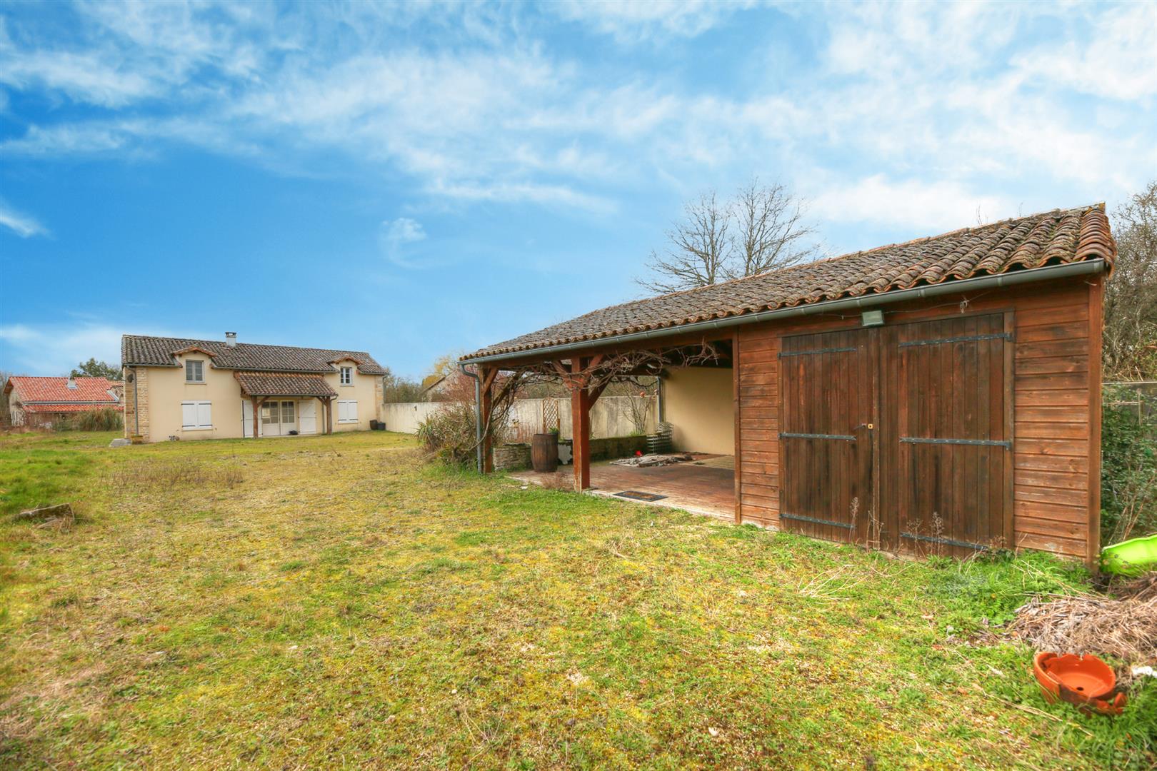 Spacious and light filled barn conversion with guest cottage and 2 acres of gardens.