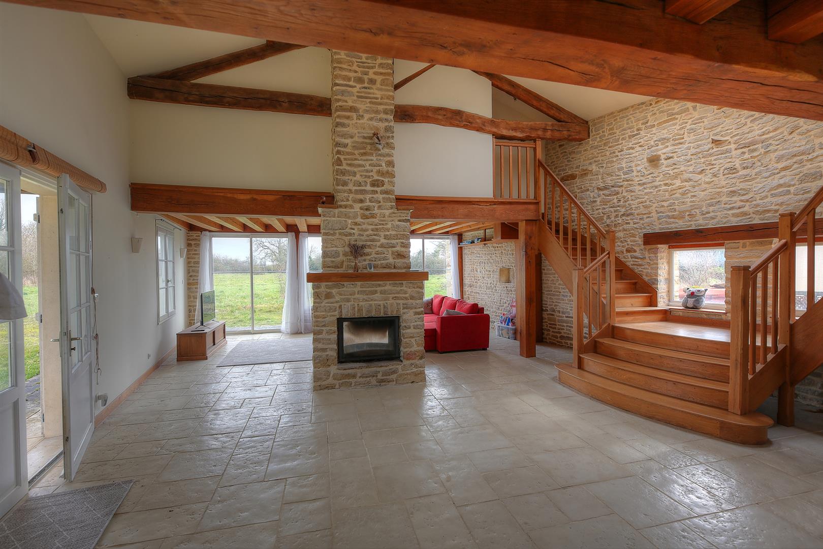 Spacious and light filled barn conversion with guest cottage and 2 acres of gardens.
